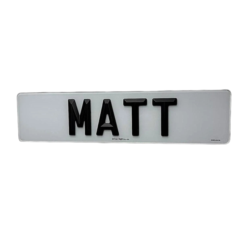 A number plate with Matte 4D retro letters spelling 'MATT', mounted on a plain white wall.
