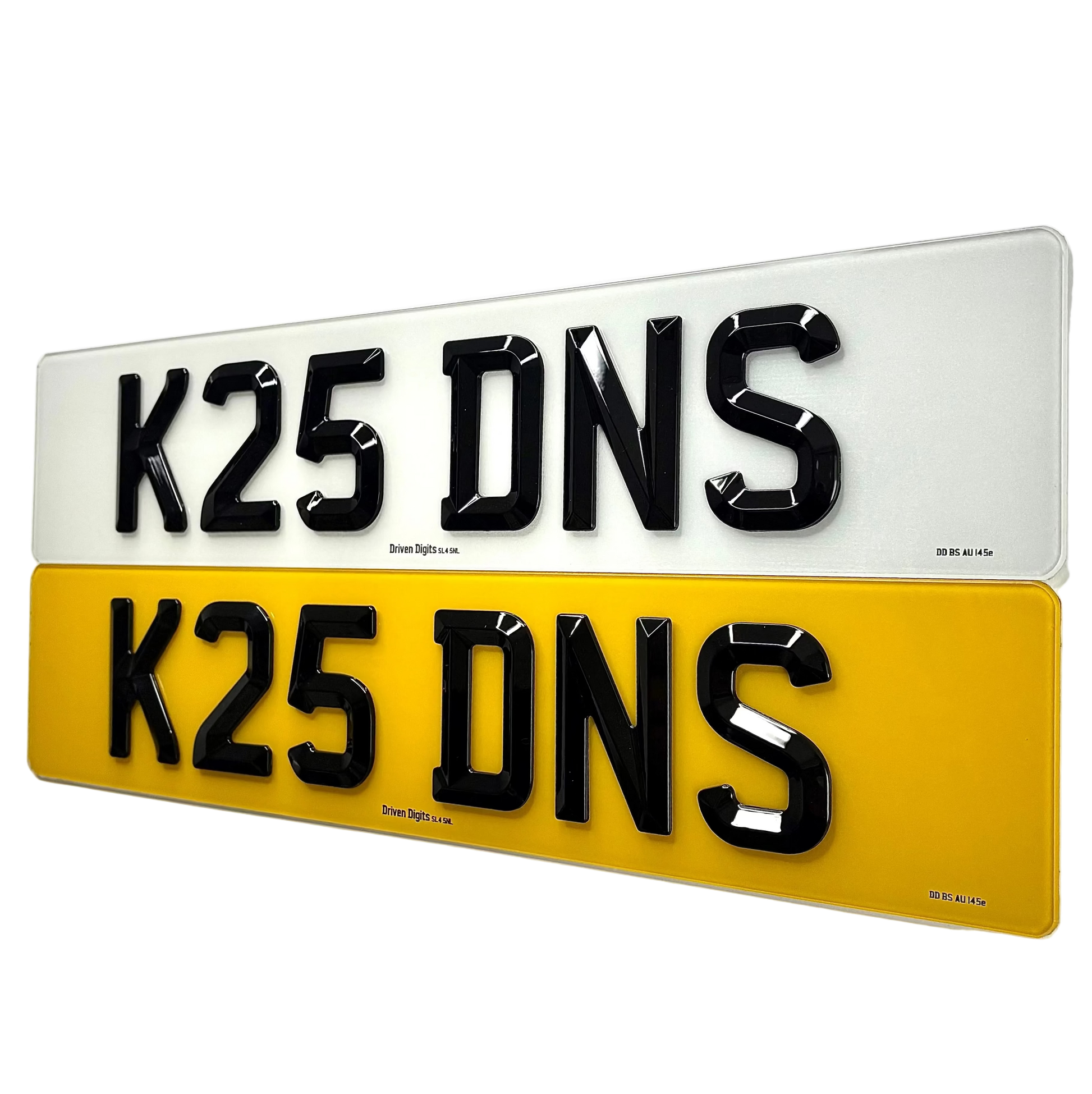 Two 3D-effect license plate letters reading 'K25 DNS' shown stacked vertically on a white background. The top plate is white with black letters, and the bottom plate is yellow with black letters.