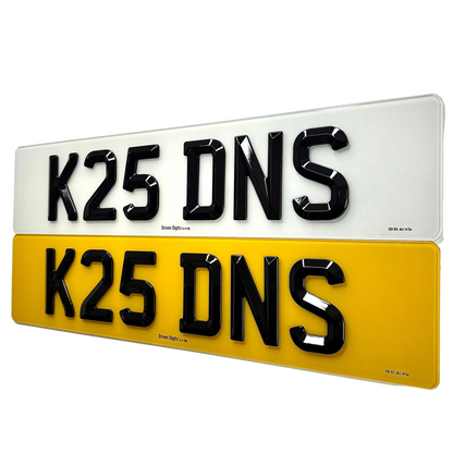 Two 3D-effect license plate letters reading 'K25 DNS' shown stacked vertically on a white background. The top plate is white with black letters, and the bottom plate is yellow with black letters.