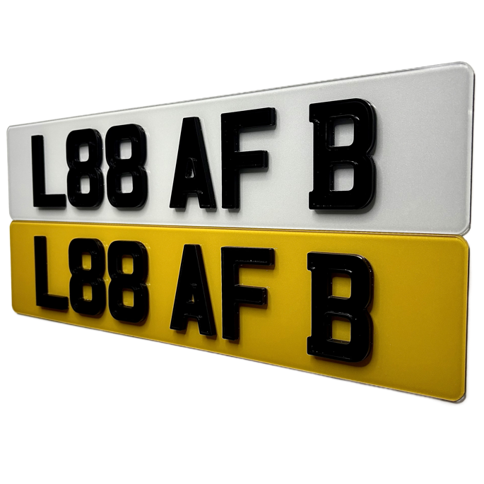 Two license plates with black text on a white and yellow background