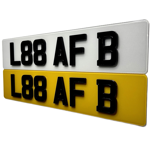 Two license plates with black text on a white and yellow background