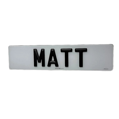 A number plate with Matte 4D retro letters spelling 'MATT', mounted on a plain white wall.