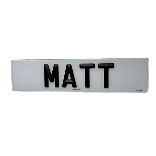 A number plate with Matte 4D retro letters spelling 'MATT', mounted on a plain white wall.