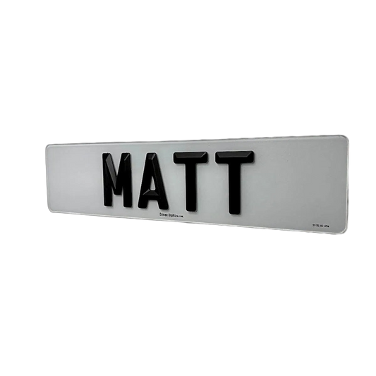 A number plate with Matte 4D retro letters spelling 'MATT', mounted on a plain white wall.