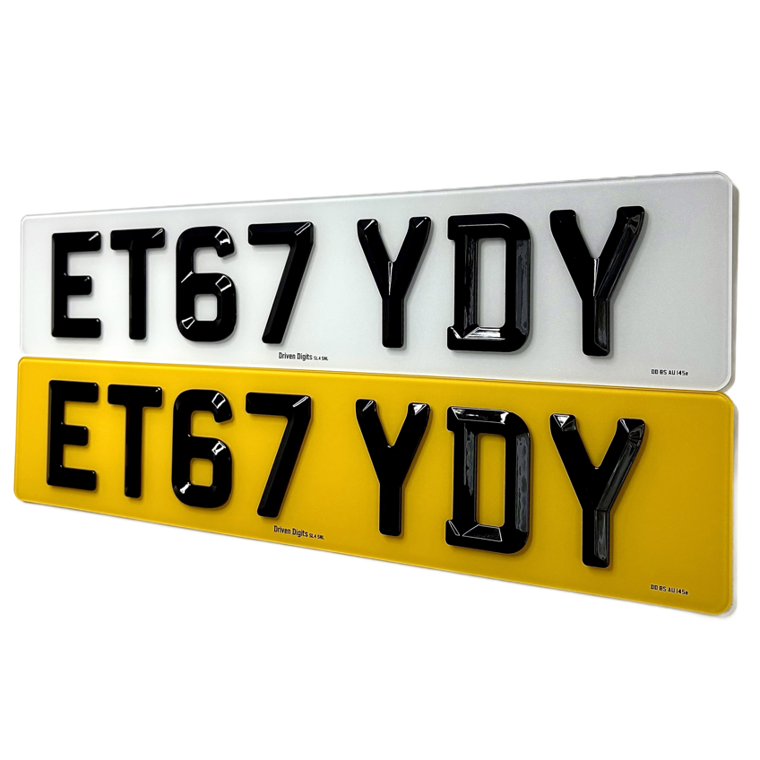Two rectangular license plate style signs shown on a white background, one white and one yellow, both with black raised alphanumeric lettering reading ET67 YDY.