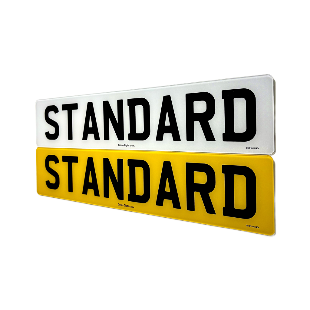 Two rectangular sign plates shown on a white background, one white with black text reading STANDARD and one yellow with black text reading STANDARD.