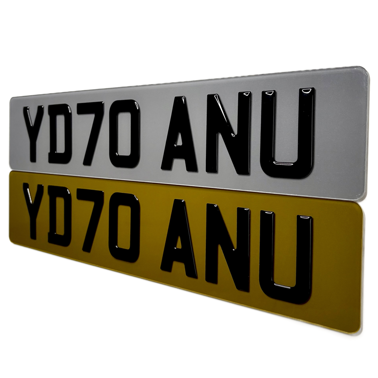 Two tinted number plates with 'YD70 ANU' text on a white background