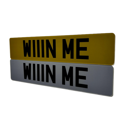 A pair or tinted printed show number plates saying win me for a car competition company TWD Comps