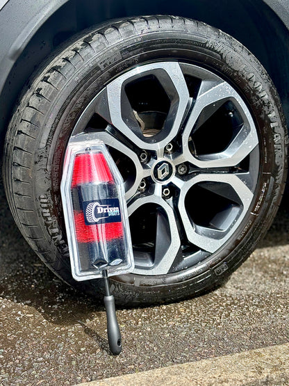 Car wheel showing a wheel cleaning brush by Driven Digits